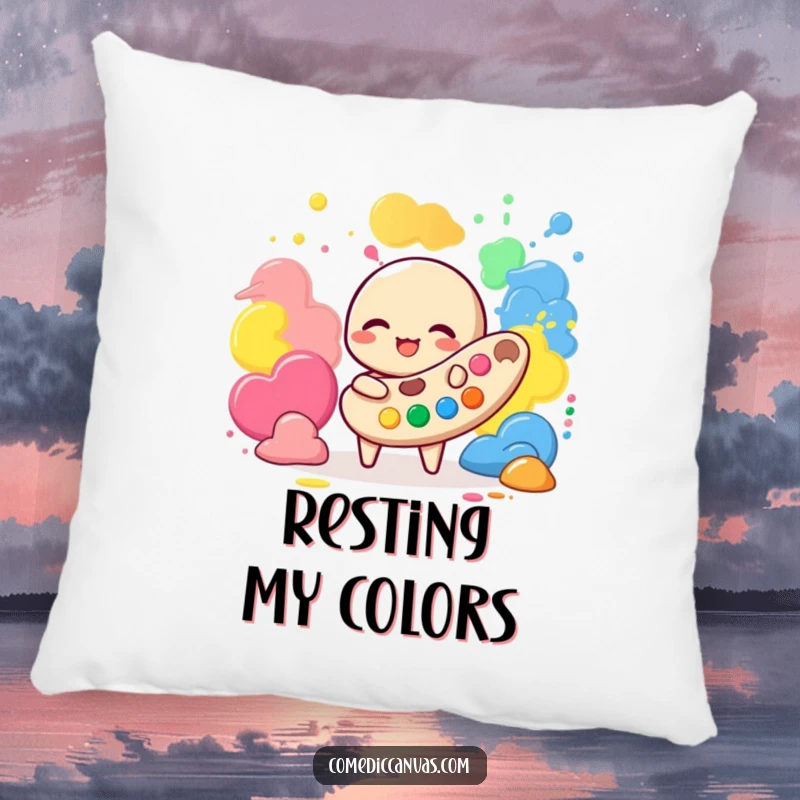 Funny pillow featuring a giggling palette character playing with vibrant paint blobs, offering artistic charm and comfort.