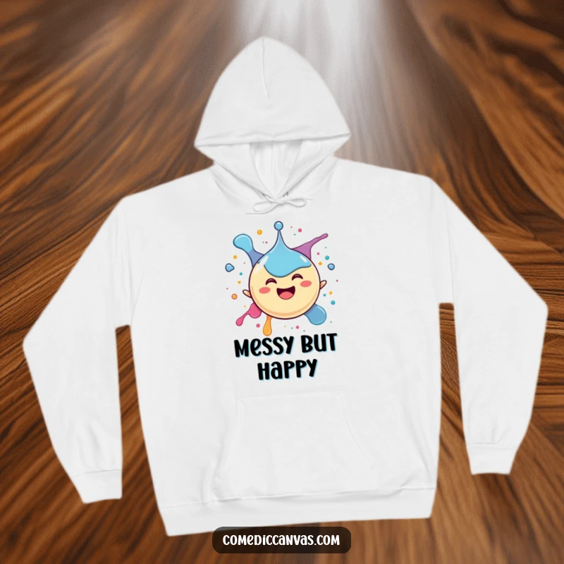 Funny hoodie depicting a happy spherical ink drop character joyfully splattering itself, offering warmth and a touch of playful exuberance.