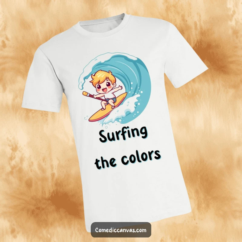 Funny t-shirt depicting a giggling character surfing a canvas wave on a paintbrush, a vibrant and humorous design for art lovers.